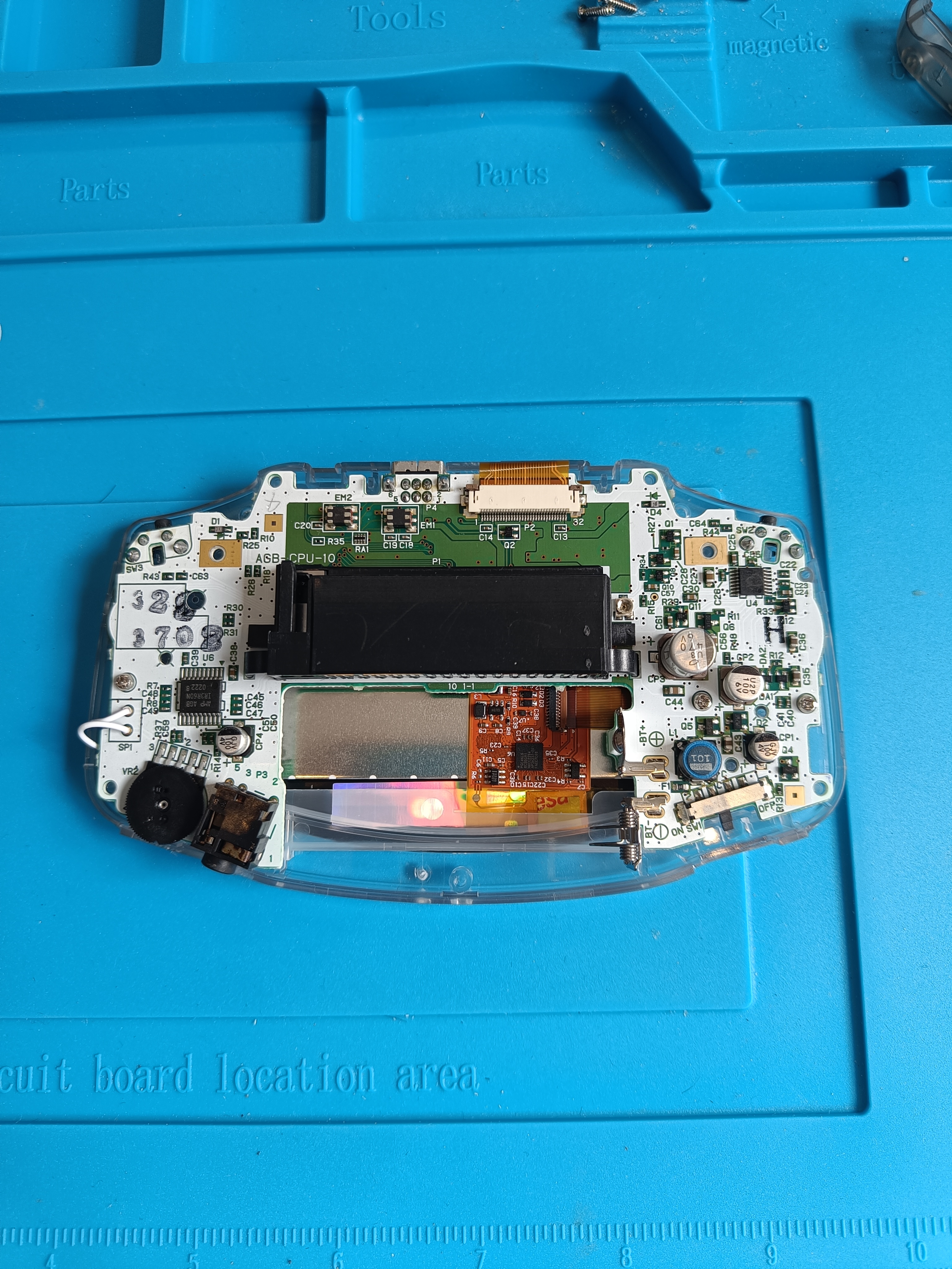 GBA motherboard mounted on front shell